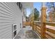 Covered porch with wooden railing and view of the neighborhood at 6703 Cameron Rd, Morrow, GA 30260