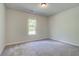 Bright bedroom with carpet and large window at 509 Dolce Rd, Locust Grove, GA 30248