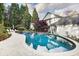 Tranquil pool with waterfall feature and ample patio space at 11 Old Paces Nw Pl, Atlanta, GA 30327