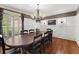 Bright dining room with hardwood floors, wainscoting, and large windows at 6080 Camelia Dr, Douglasville, GA 30135