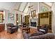 Living room with built-in shelving, fireplace, and hardwood floors at 6080 Camelia Dr, Douglasville, GA 30135