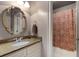 Bathroom with granite vanity and patterned shower curtain at 2788 Bridle Ridge Way, Buford, GA 30519