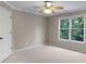 Bedroom with ceiling fan and large window at 2788 Bridle Ridge Way, Buford, GA 30519