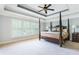 Main bedroom with a post bed and large windows at 1191 Hillside Green Way, Powder Springs, GA 30127