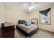 Simple bedroom with ceiling fan, window, and double bed at 175 Highland Cir, Mcdonough, GA 30253