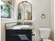 Modern bathroom with granite countertop and dark vanity at 2936 Belvedere Ln, Decatur, GA 30032