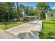 Spacious driveway leading to a charming ranch home with well-maintained lawn at 2936 Belvedere Ln, Decatur, GA 30032