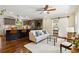 Open plan living room and kitchen area with modern finishes, wood floors, and recessed lighting at 2936 Belvedere Ln, Decatur, GA 30032