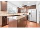 Kitchen with dark cabinets, granite countertops, and island at 3996 Princeton Lakes Sw Way, Atlanta, GA 30331