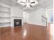 Living area with hardwood floors, fireplace and built-in shelves at 3996 Princeton Lakes Sw Way, Atlanta, GA 30331