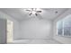 Main bedroom with vaulted ceiling, ceiling fan and ensuite bathroom at 3996 Princeton Lakes Sw Way, Atlanta, GA 30331