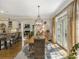 Bright dining room with hardwood floors, large windows and a chandelier at 465 Verdi Ln, Sandy Springs, GA 30350