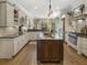 Modern kitchen featuring granite countertops, custom cabinetry, and stainless steel appliances at 465 Verdi Ln, Sandy Springs, GA 30350