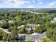 Aerial view of community and surrounding wooded area at 5512 Glenridge Ne Dr # E, Sandy Springs, GA 30342