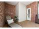 Small deck or patio with seating and brick wall at 5512 Glenridge Ne Dr # E, Atlanta, GA 30342