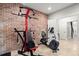 Well-equipped home gym with Bowflex machine and stationary bike at 5512 Glenridge Ne Dr # E, Atlanta, GA 30342