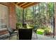 Cozy brick patio with seating area, overlooking a fenced backyard at 5512 Glenridge Ne Dr # E, Atlanta, GA 30342