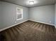 Simple bedroom with neutral walls and carpet flooring at 60 Hammock Dr, Covington, GA 30016