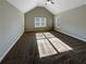 Large bedroom with vaulted ceiling, carpet, and window at 60 Hammock Dr, Covington, GA 30016