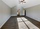 Spacious main bedroom with carpeted floors and en-suite bathroom access at 60 Hammock Dr, Covington, GA 30016