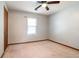 Well-lit bedroom with ceiling fan and wood trim at 752 Fallowfield Dr, Loganville, GA 30052