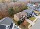 House nestled in a neighborhood with fall leaves at 904 Berry Ct, Canton, GA 30114