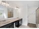 Bathroom with double vanity, large mirror, and shower at 904 Berry Ct, Canton, GA 30114