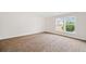 Bright bedroom with neutral walls and carpet, two windows at 904 Berry Ct, Canton, GA 30114
