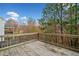 Wooden deck overlooking wooded area with fall foliage at 904 Berry Ct, Canton, GA 30114
