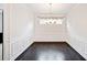 Formal dining room with dark hardwood floors and wainscoting at 904 Berry Ct, Canton, GA 30114