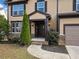 Dark brown front door, stone accents, and landscaping at 904 Berry Ct, Canton, GA 30114