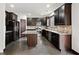 Kitchen with dark cabinetry, granite countertops, and stainless steel appliances at 904 Berry Ct, Canton, GA 30114