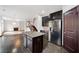 Kitchen features island, stainless steel appliances, and dark cabinetry at 904 Berry Ct, Canton, GA 30114