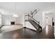 Open living room with hardwood floors and fireplace at 904 Berry Ct, Canton, GA 30114