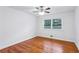 Well-lit bedroom featuring hardwood floors and ceiling fan at 1690 Creveis Rd, Austell, GA 30168