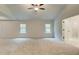 Bright and airy main bedroom with high ceilings and ceiling fan at 29 Homesite Cooper E Cv, Fayetteville, GA 30215