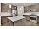 Modern kitchen with island and stainless steel appliances at 147 Stargaze Rdg, Canton, GA 30114