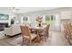 Bright dining room with hardwood floors and a view into living room at 1462 Stephens View Dr, Loganville, GA 30052