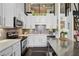 Modern kitchen with white cabinets and a stainless steel island at 174 Chester Se Ave # 109, Atlanta, GA 30316