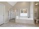 Large Primary bathroom with soaking tub, shower, and toilet at 4560 Candytuft Nw Way, Acworth, GA 30102