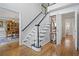 Elegant entryway with hardwood floors and staircase at 4560 Candytuft Nw Way, Acworth, GA 30102