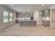 Spacious kitchen with gray cabinets and an island at 72 Homesite Corner Lot, Fayetteville, GA 30215