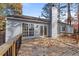 Gray siding house with a wooden deck and chimney at 2742 Country Creek Nw Way, Kennesaw, GA 30152