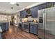 Modern kitchen with stainless steel appliances and dark blue cabinets at 1008 Ashfern Walk, Woodstock, GA 30189