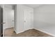 Bright bedroom with hardwood floors and double closets at 7264 Crestside Dr, Austell, GA 30168