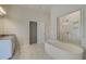 Elegant bathroom with soaking tub, walk-in shower, and separate vanity at 2376 Cadenza Cir, Dacula, GA 30019