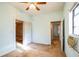 Bedroom with ceiling fan and access to other rooms at 492 S Cherokee Rd, Social Circle, GA 30025