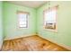 Simple bedroom with light green walls and window coverings at 492 S Cherokee Rd, Social Circle, GA 30025