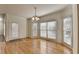 Bright dining room with hardwood floors and large windows at 4949 Moore Rd, Suwanee, GA 30024