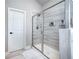 Large walk-in shower with modern glass enclosure at 106 Cottontail Ln, Loganville, GA 30052